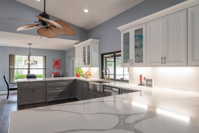 kitchen with a wealth of natural light, sink, dark wood-type flooring, and gray cabinets