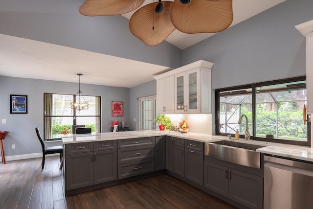 kitchen with white cabinets, a healthy amount of sunlight, stainless steel dishwasher, and sink