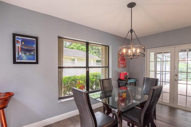 dining room with a wealth of natural light, french doors, and dark hardwood / wood-style flooring