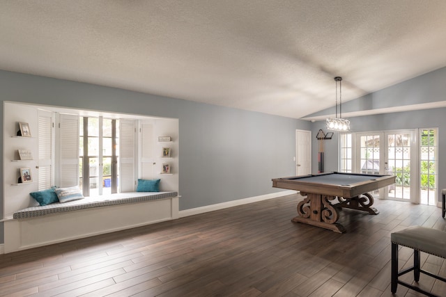 game room featuring lofted ceiling, french doors, a textured ceiling, and dark hardwood / wood-style flooring