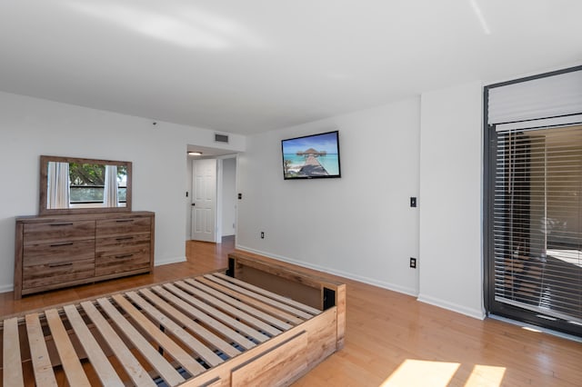 bedroom featuring light wood-type flooring