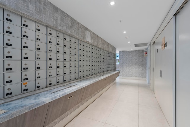 hallway featuring mail boxes and elevator