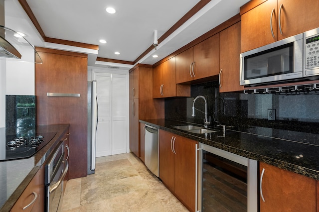 kitchen featuring beverage cooler, appliances with stainless steel finishes, sink, and dark stone counters