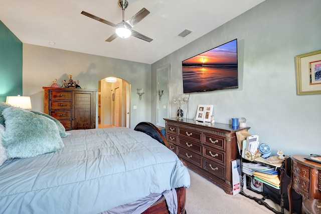 bedroom featuring light carpet and ceiling fan