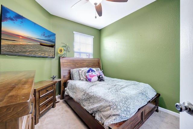 bedroom featuring ceiling fan and light colored carpet