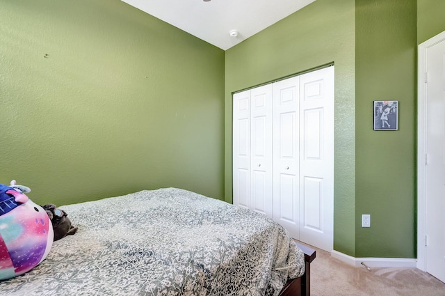 carpeted bedroom with a closet