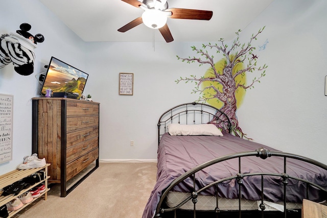 bedroom featuring ceiling fan and light carpet