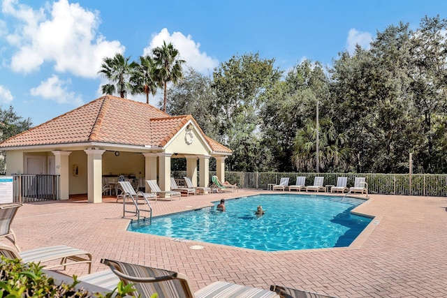 view of swimming pool featuring a patio