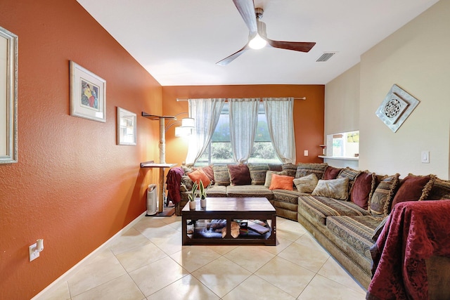 living room with ceiling fan and light tile patterned floors