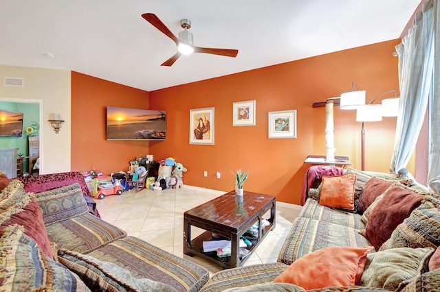 living room featuring ceiling fan and light tile patterned floors