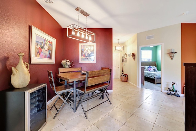 dining room with wine cooler and light tile patterned floors