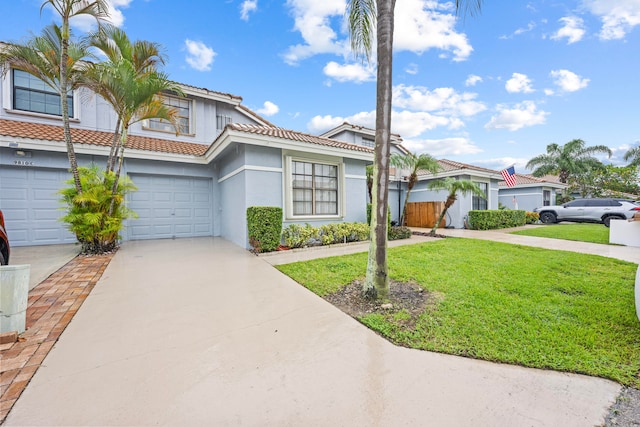 view of front of home featuring a garage and a front lawn