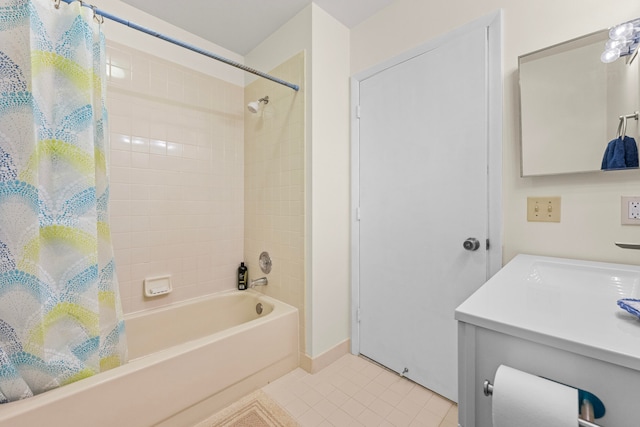 bathroom with tile patterned floors, vanity, and shower / tub combo with curtain