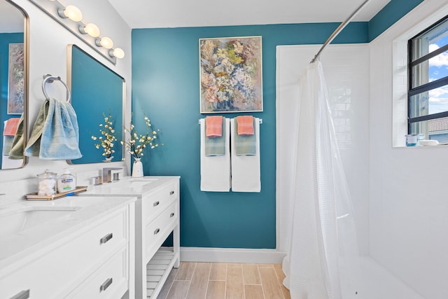 bathroom with a shower with curtain and vanity