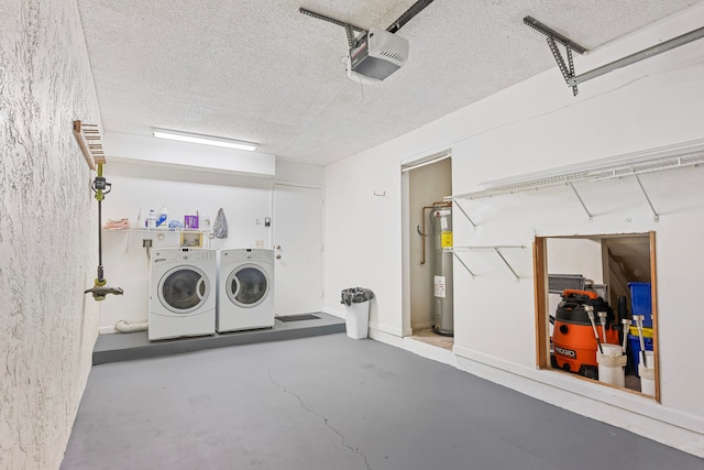 laundry room featuring electric water heater and separate washer and dryer