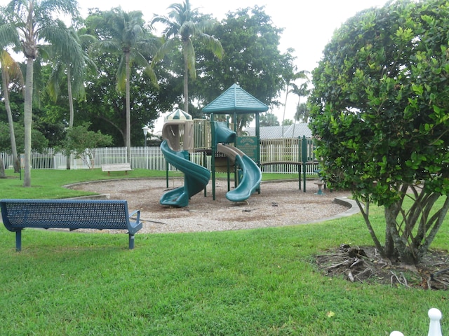 view of playground with a lawn