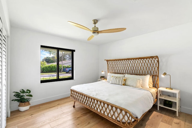 bedroom with light wood-type flooring and ceiling fan