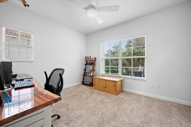 office with light carpet and ceiling fan