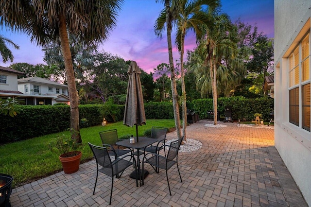 patio terrace at dusk with a lawn