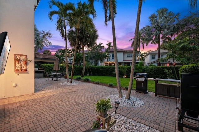 patio terrace at dusk with a lawn