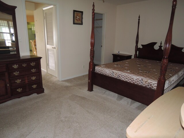 408 Sandpiper Dr Unit C, Fort Pierce, FL 34982 - bedroom with baseboards and light colored carpet