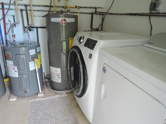 laundry area featuring washing machine and clothes dryer and electric water heater