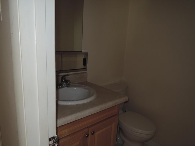 bathroom with vanity and toilet