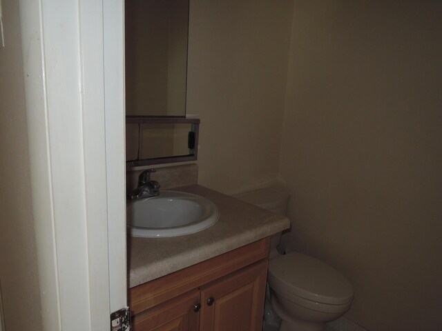 408 Sandpiper Dr Unit C, Fort Pierce, FL 34982 - half bathroom featuring vanity and toilet