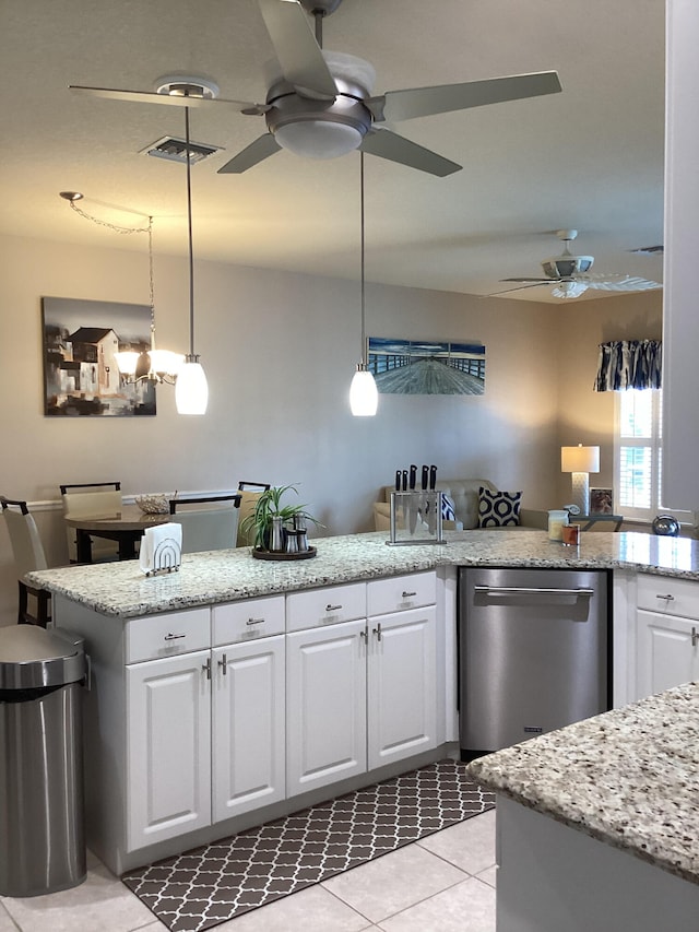 kitchen with white cabinets, dishwasher, and decorative light fixtures