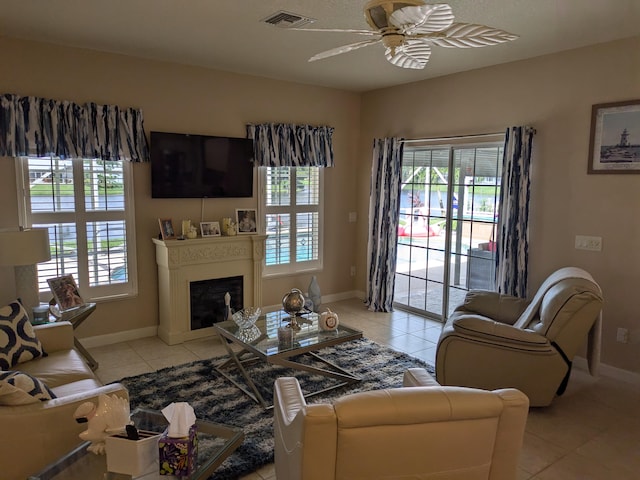 living room featuring light tile patterned floors and a healthy amount of sunlight