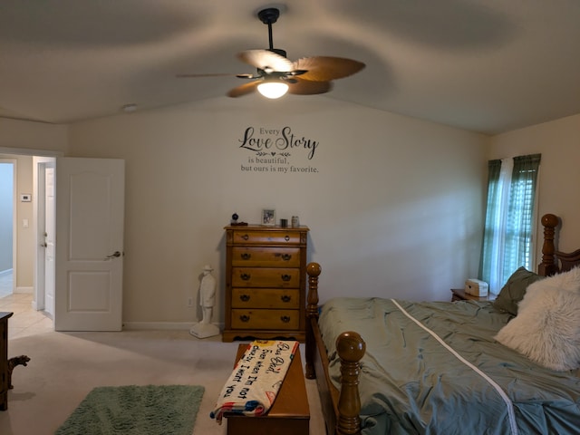 bedroom featuring light carpet, vaulted ceiling, and ceiling fan