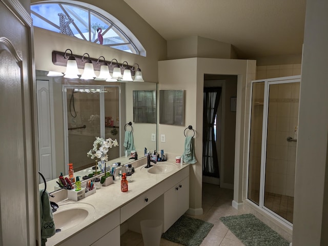 bathroom featuring tile patterned flooring, vanity, an enclosed shower, and vaulted ceiling