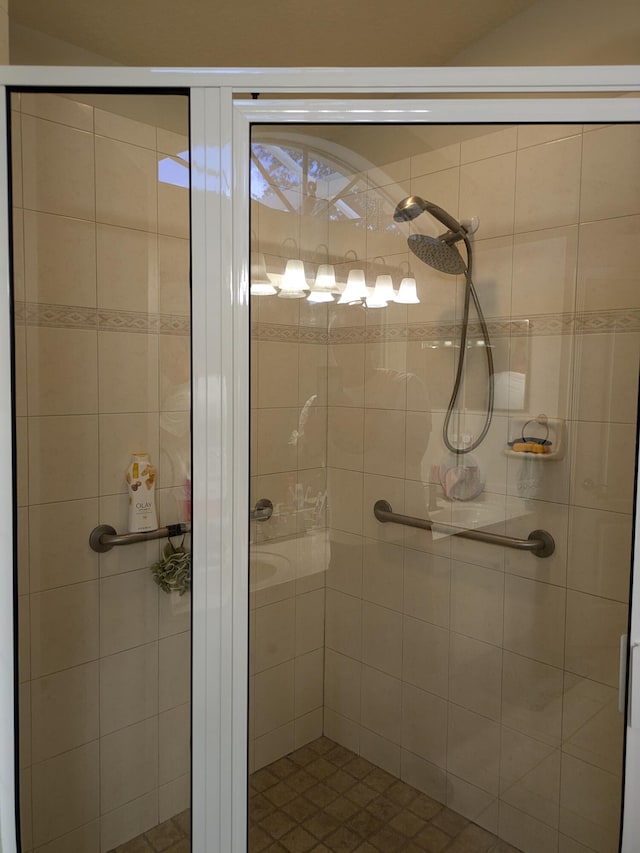 bathroom featuring a shower with door