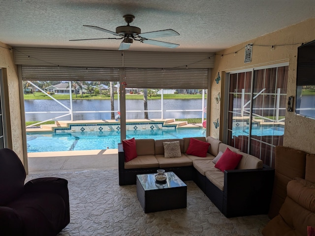 view of swimming pool with ceiling fan