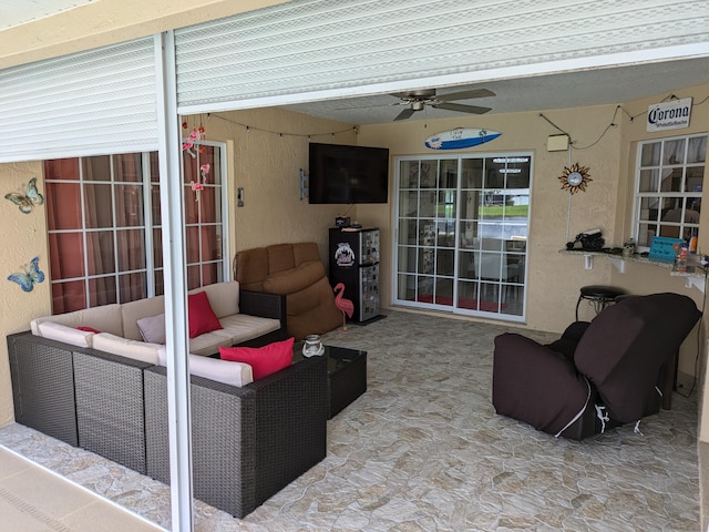 view of patio featuring outdoor lounge area and ceiling fan