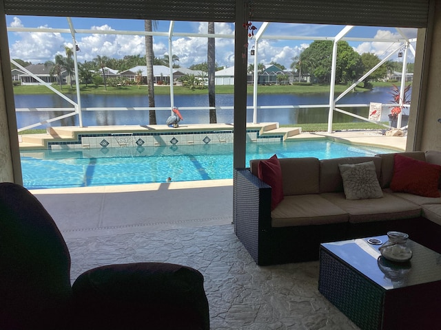 view of swimming pool featuring a water view