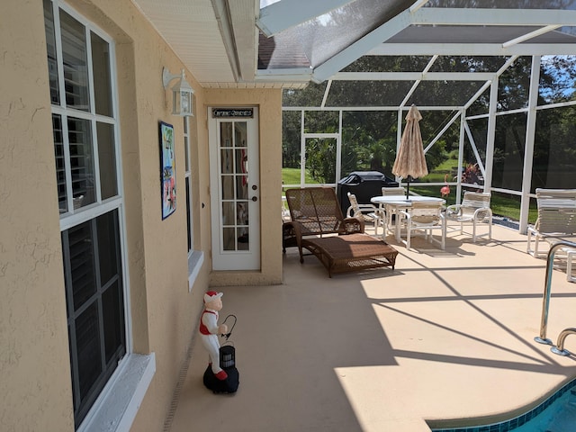 view of patio / terrace with a lanai