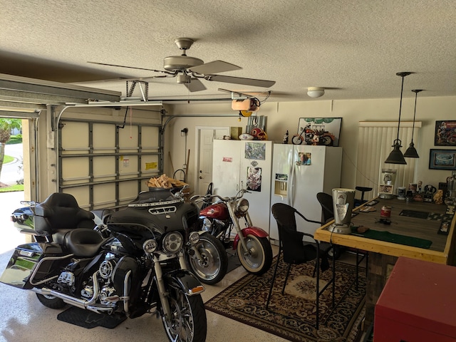 garage with a garage door opener, ceiling fan, and white fridge with ice dispenser