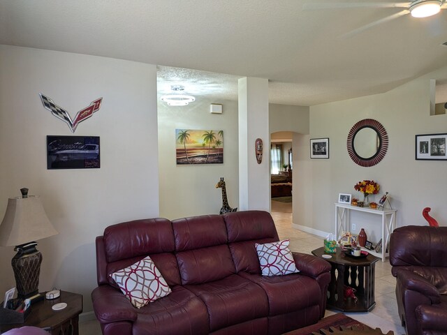 tiled living room with a textured ceiling