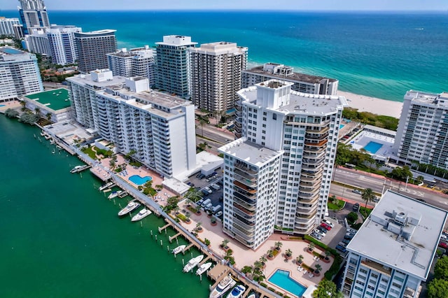 drone / aerial view featuring a water view and a city view