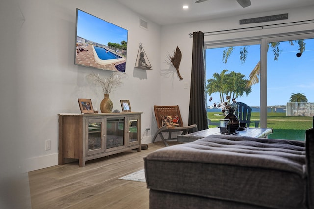 bedroom featuring light hardwood / wood-style flooring and ceiling fan