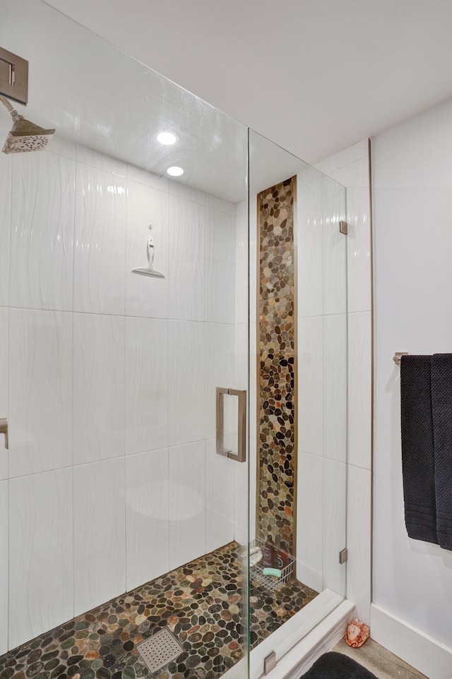 bathroom featuring an enclosed shower