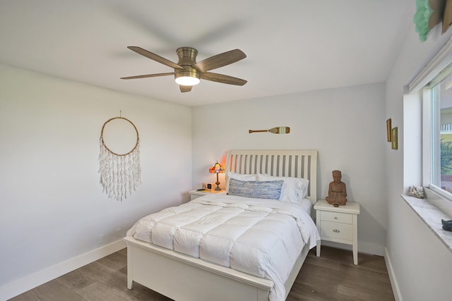 bedroom featuring dark hardwood / wood-style floors and ceiling fan