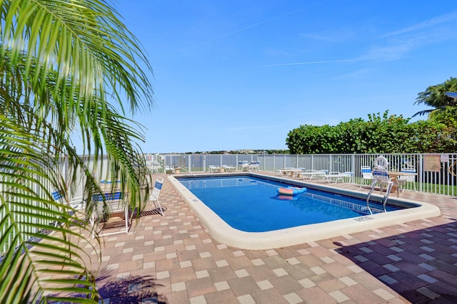 view of pool featuring a patio area