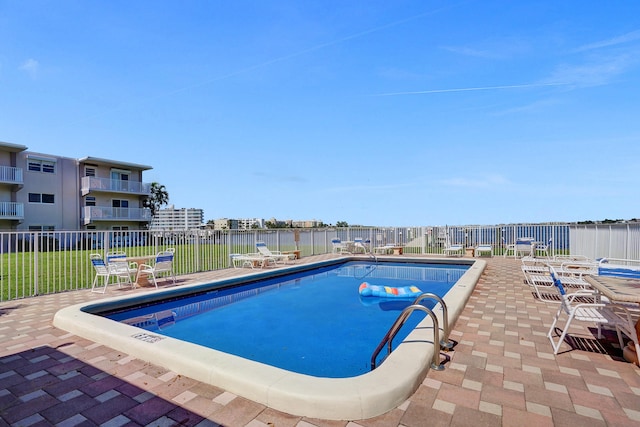 view of swimming pool featuring a patio