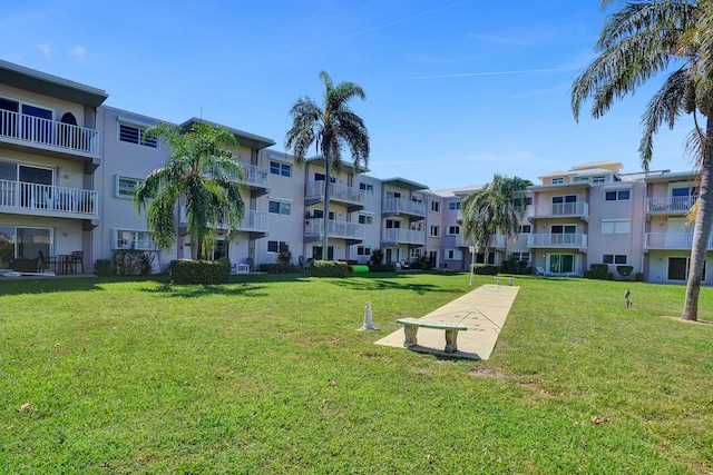 view of community featuring a lawn