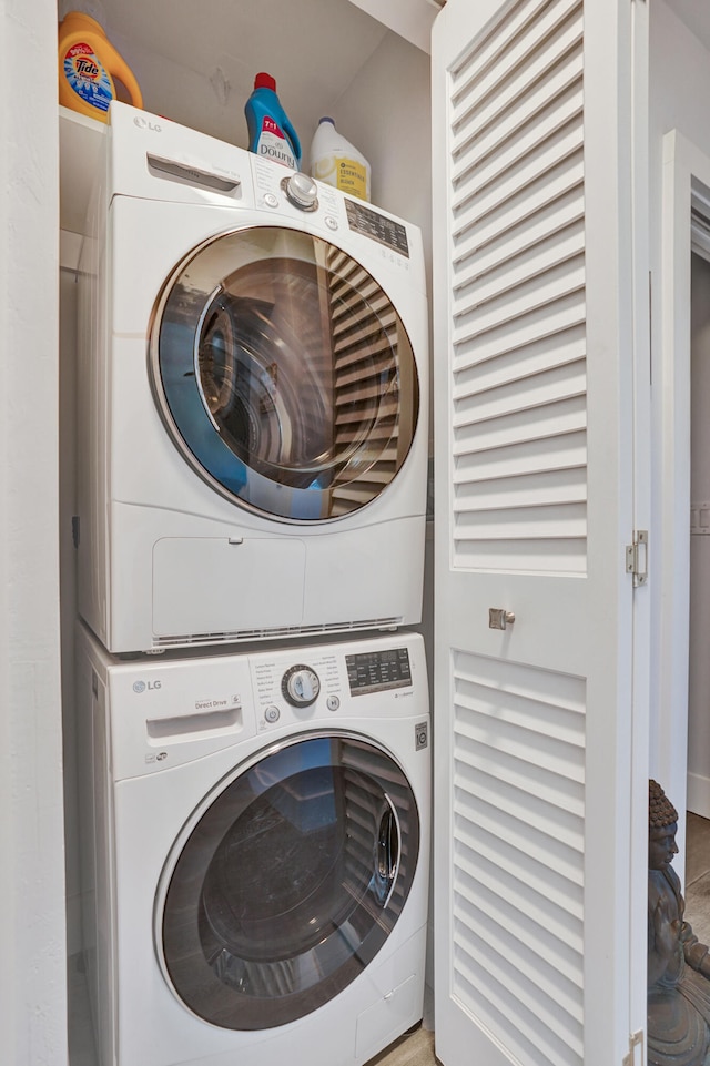 laundry room featuring stacked washer and clothes dryer