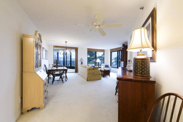 carpeted dining area featuring a notable chandelier