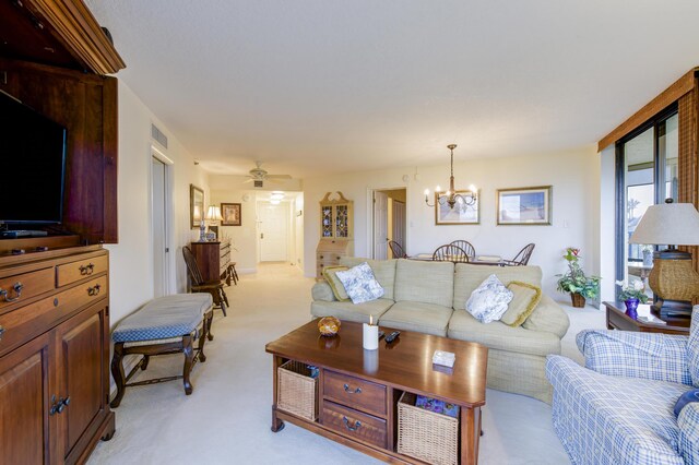 kitchen with light carpet, light stone countertops, stainless steel appliances, and sink