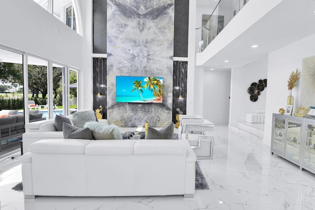 living room featuring tile walls and a high ceiling